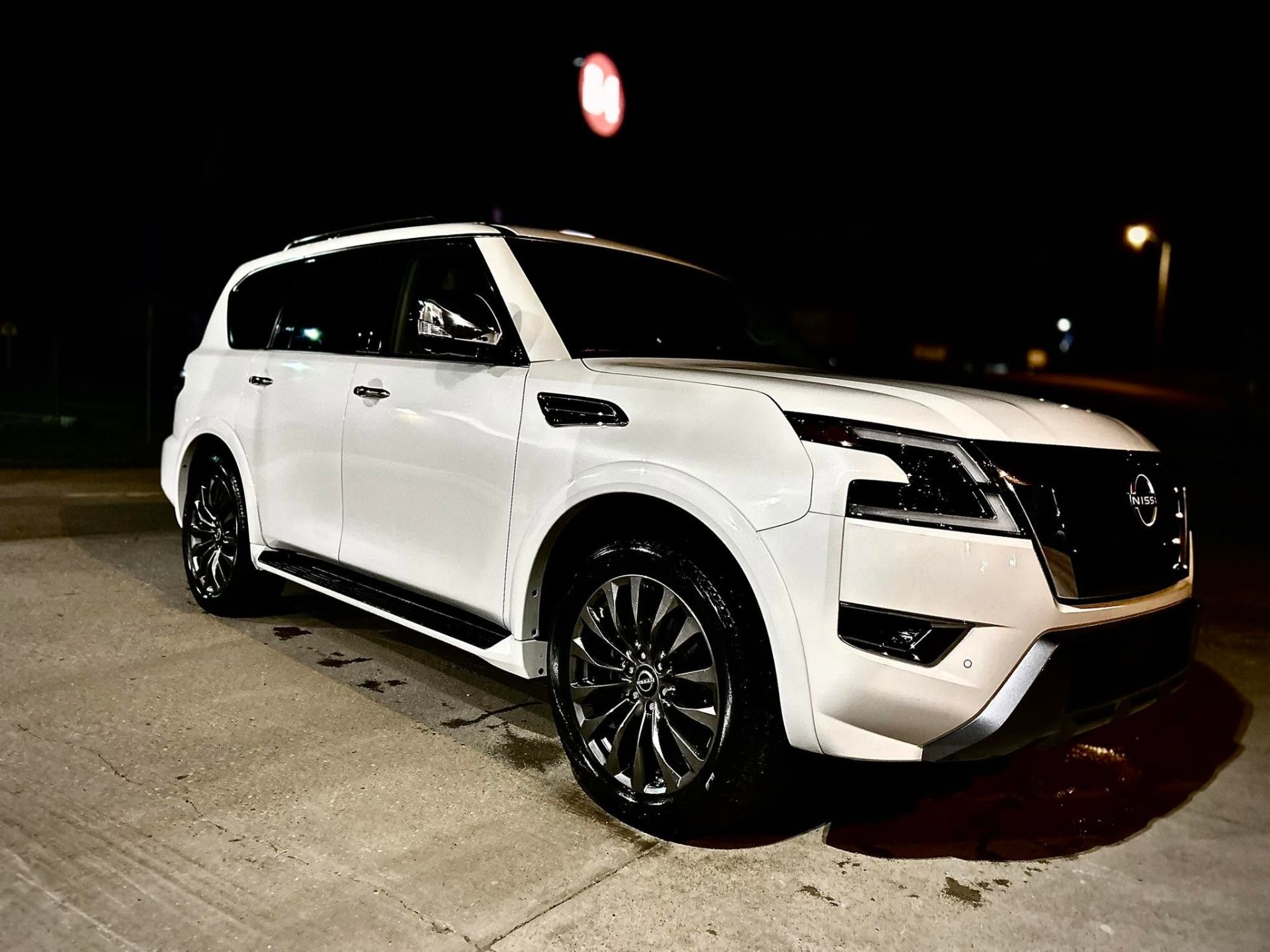 White Nissan Armada gleaming after a full detail
